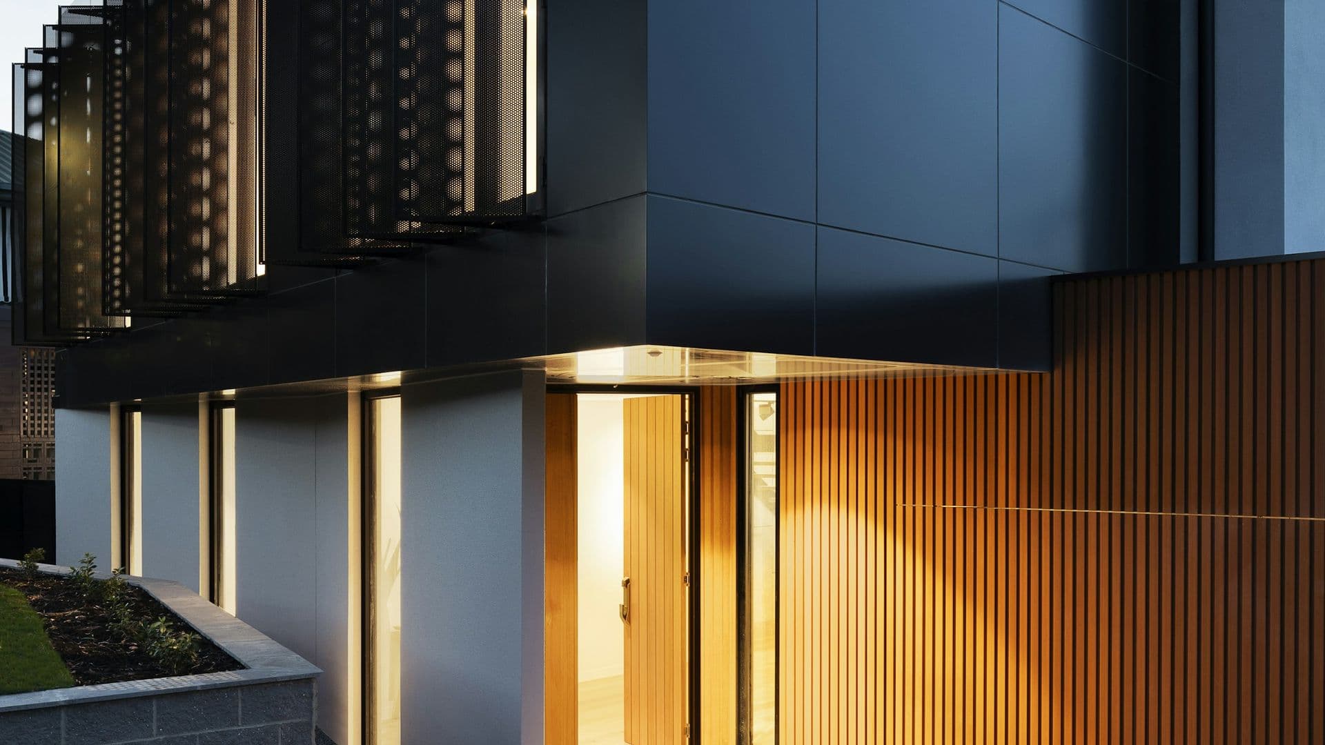 Modern two-story home exterior at dusk